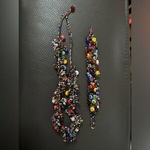 Vintage multi colored necklace and bracelet set. Looks hand made very colorful!